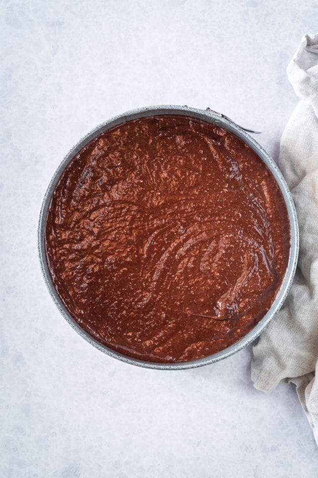 cake pan full of chocoalte cake batter