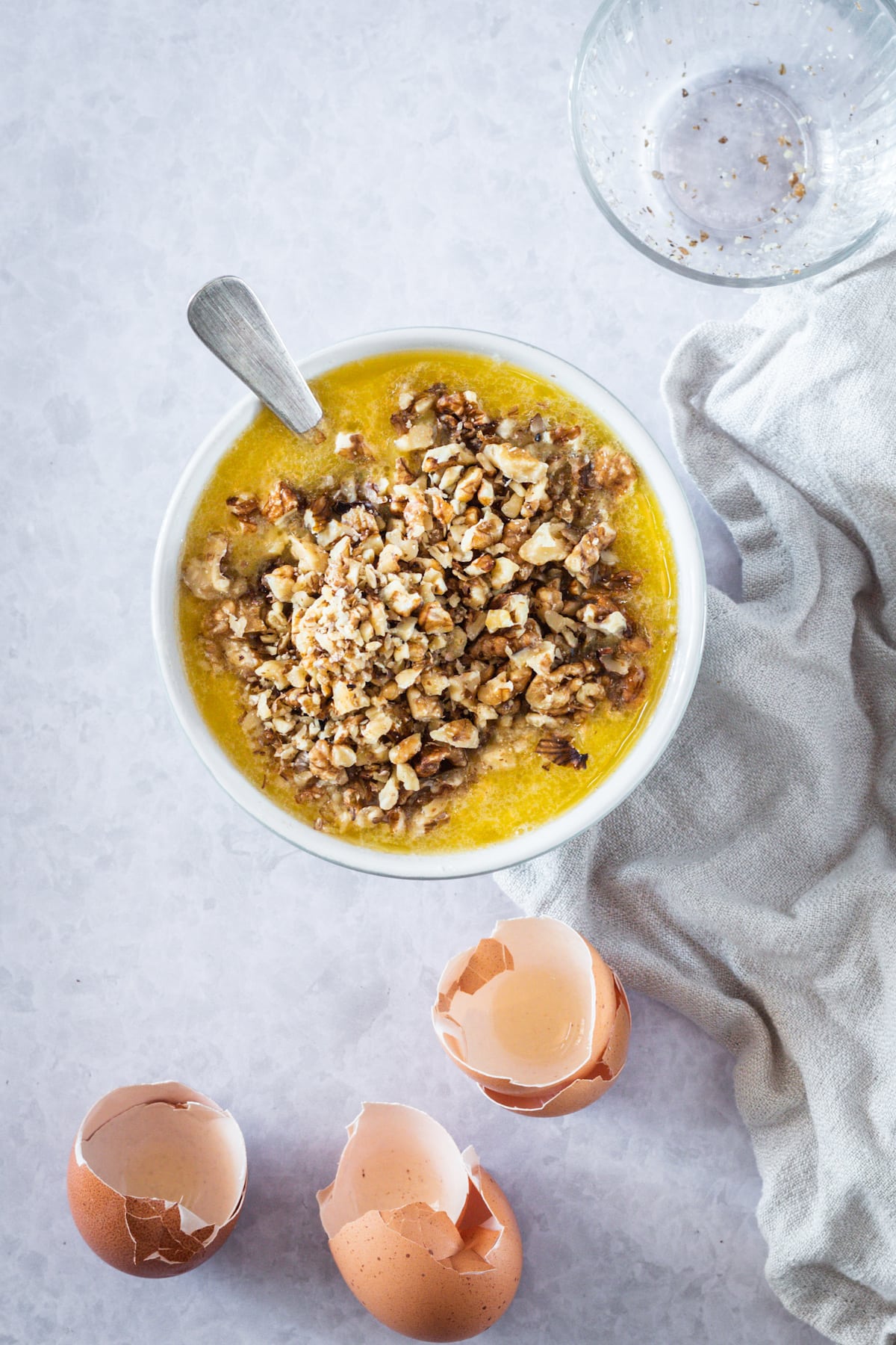 mixing bowl with melted butter and pecans