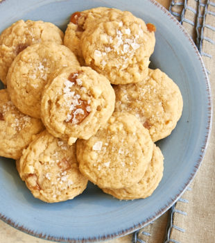 overhead view of Caramel Cashew Cookies on a blue plate