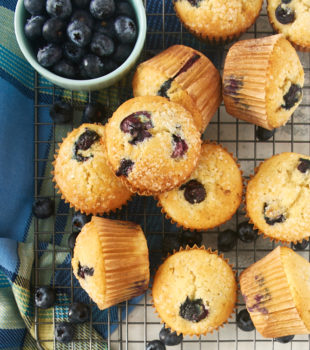 overhead view of blueberry muffins on a wire rack
