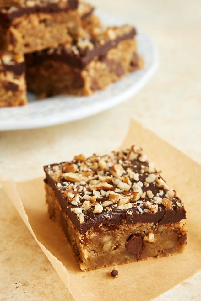 a chocolate chip blondie on a square of parchment paper