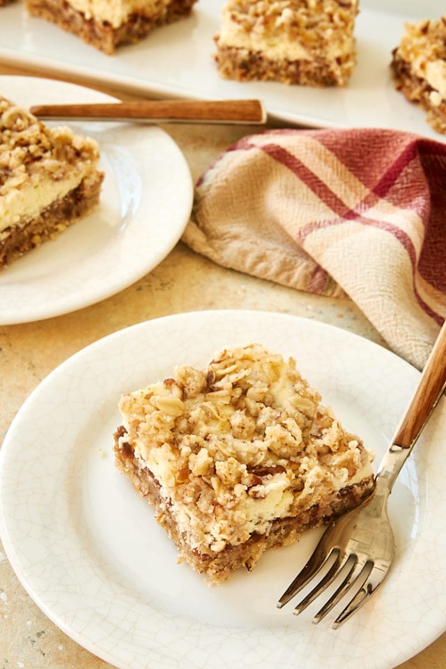 slices of Apple Butter Cream Cheese Oat Bars on white plates