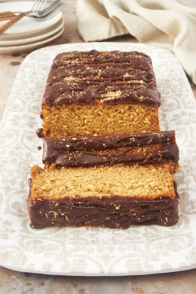 sliced Graham Cracker Cake on a beige and white platter