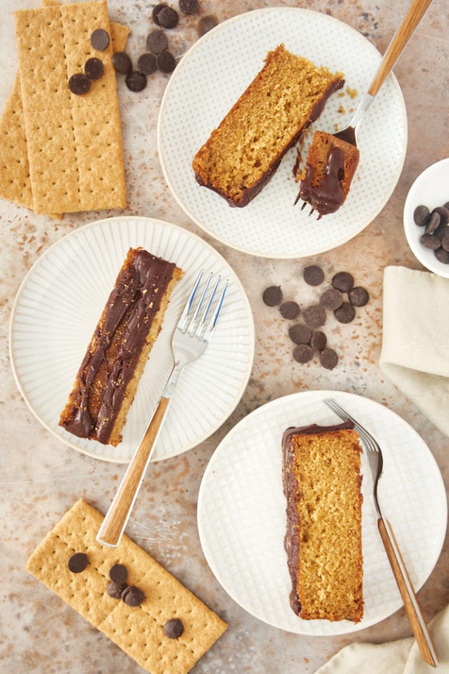 overhead view of slices of Graham Cracker Cake on white and beige plates