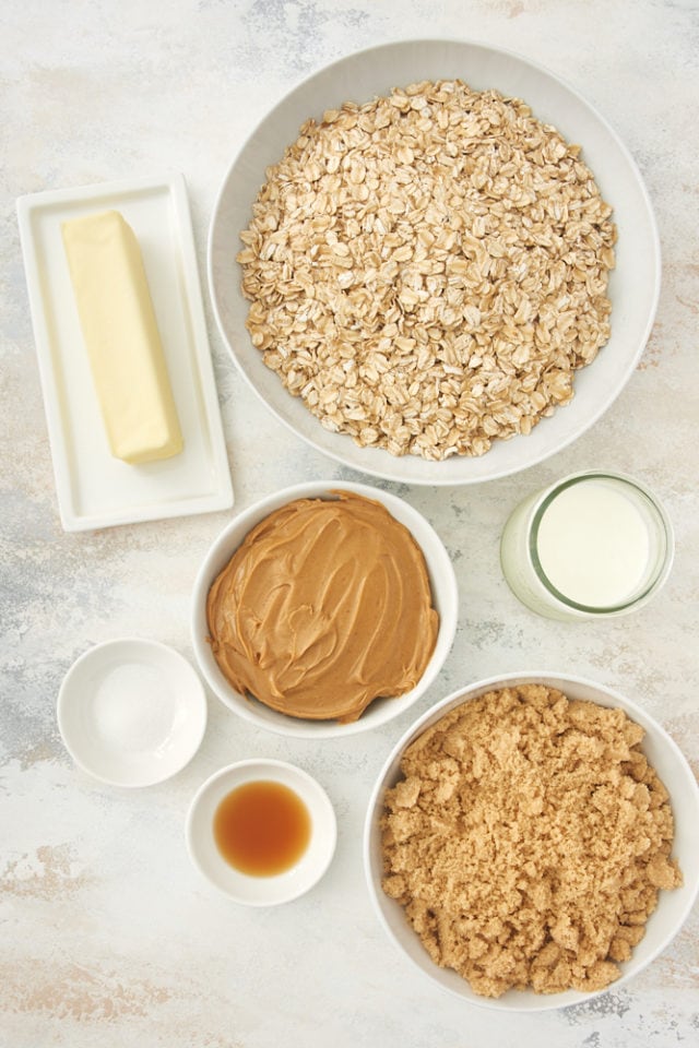 ingredients for no bake peanut butter oatmeal cookies, including oats, peanut butter, butter, and vanilla extract