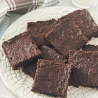 pile of brownies on a white plate