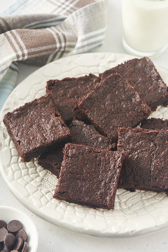 pile of brownies on a white plate