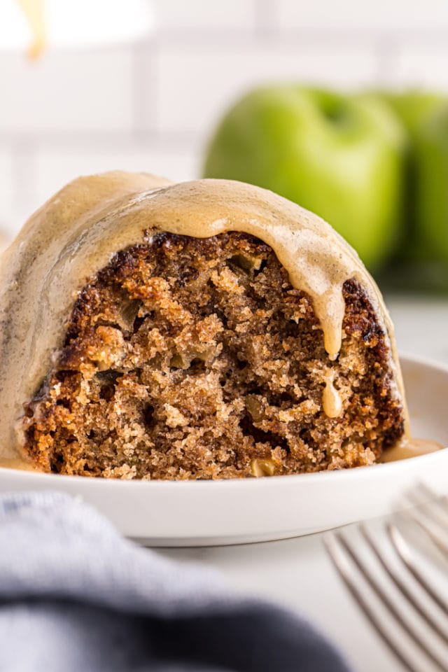 close up view of a slice of Apple Spice Cake on a white plate