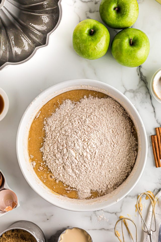 dry ingredients added to wet ingredients for apple spice cake