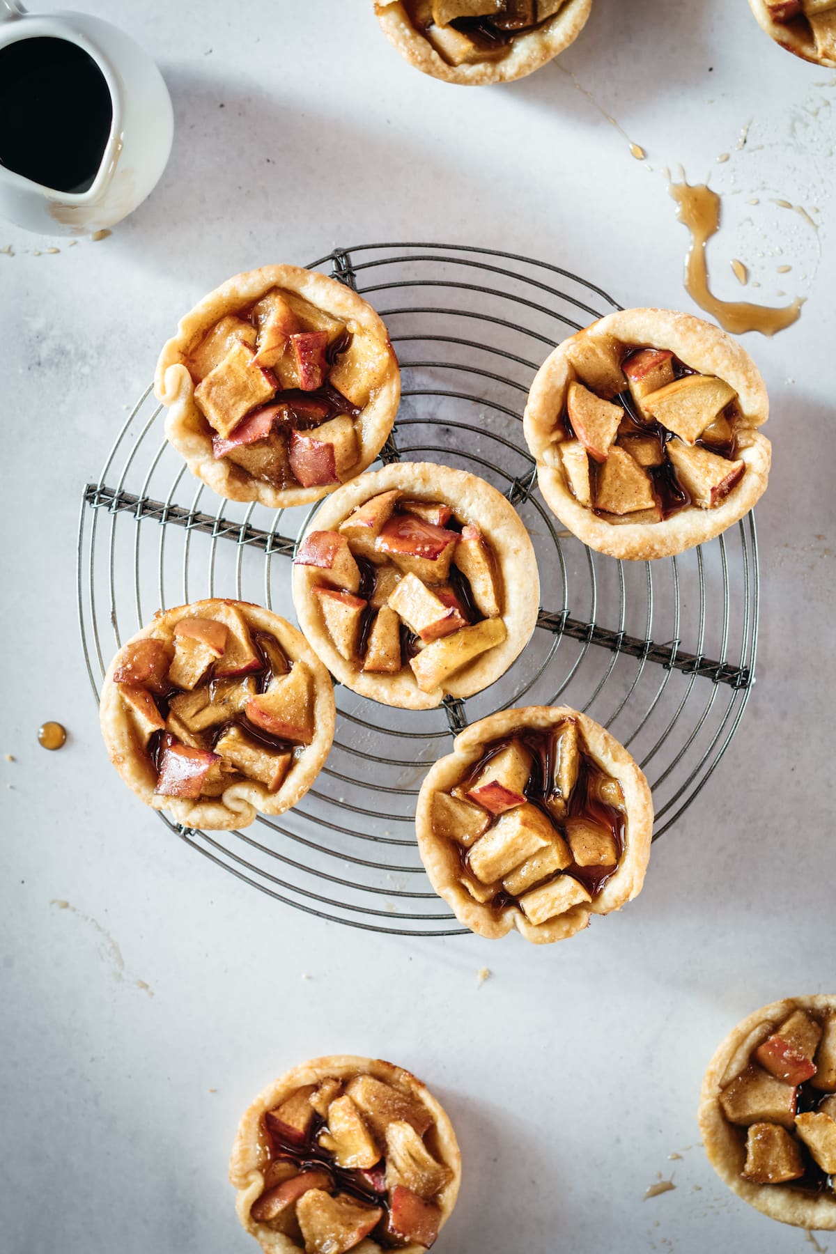 Overhead shot of Mini Caramel Apple Pies on cooling rack