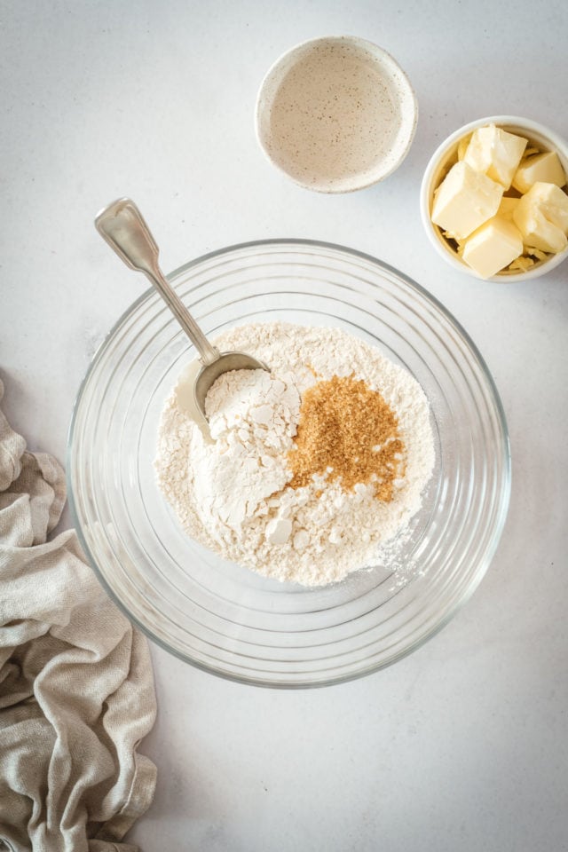 Overhead shot of dry pie crust ingredients in glass bowl