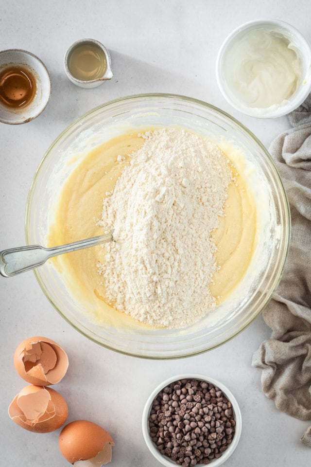 Overhead shot of Chocolate Chip Cake batter with flour being incorporated