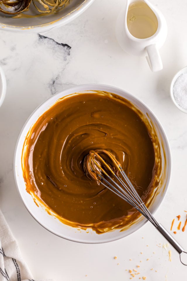 overhead view of dulce de leche glaze in a white mixing bowl