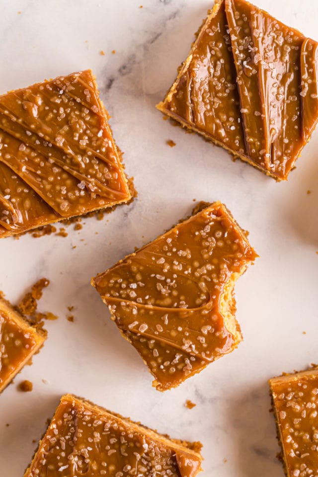 overhead view of cheesecake bars on a marble surface