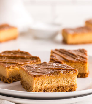 sliced Dulce de Leche Cheesecake Bars on a white plate