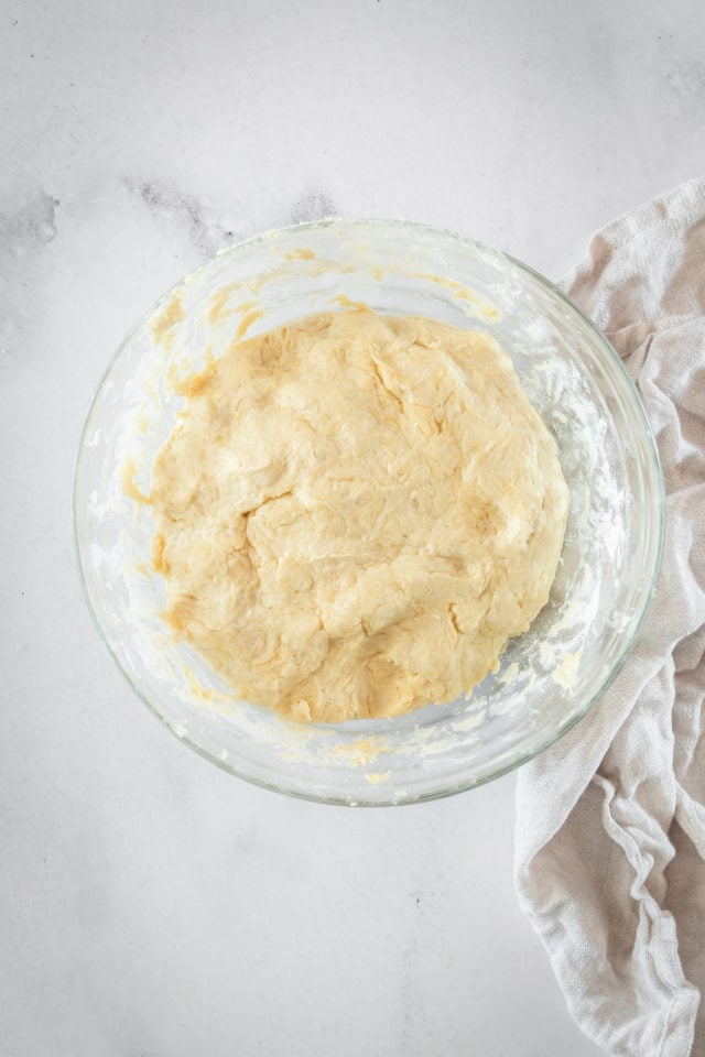 Overhead shot of dough in glass bowl