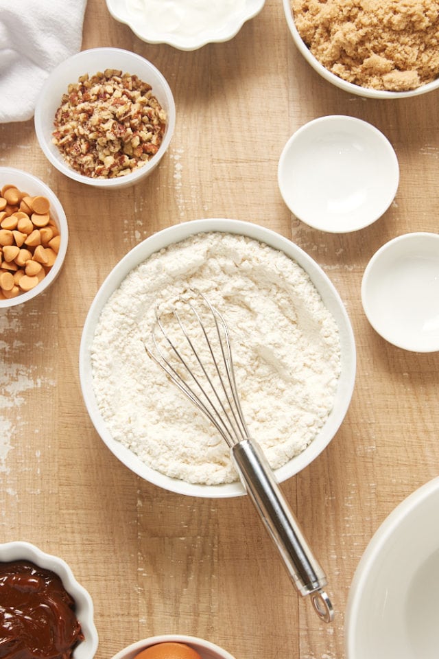 overhead view of dry ingredients mixed in a white mixing bowl