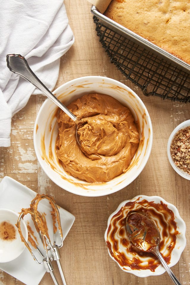 overhead view of dulce de leche frosting in a white mixing bowl