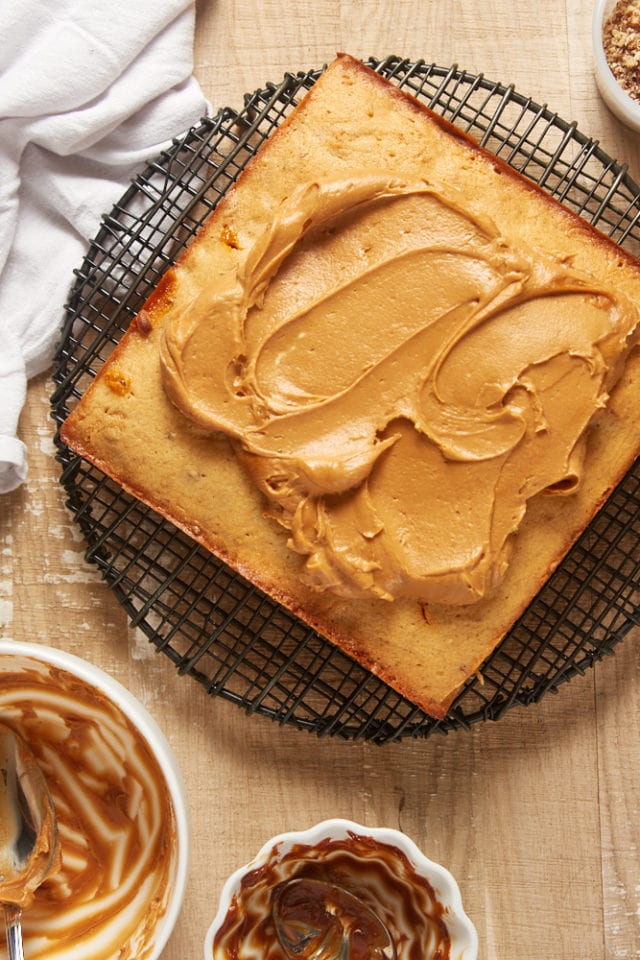 overhead view of dulce de leche frosting on a brown sugar cake
