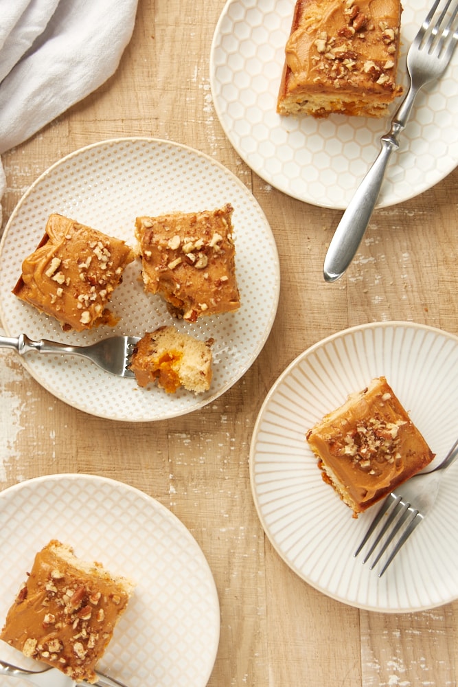 overhead view of Brown Sugar Snack Cake slices on white and beige plates