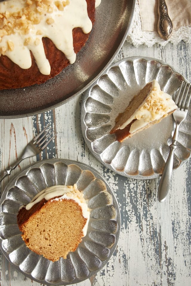 overhead view of slices of Cinnamon Hazelnut Bundt Cake on pewter plates