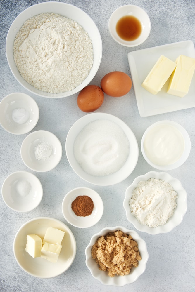 ingredients for coffee cake, including flour, sugar, butter, eggs, and cinnamon