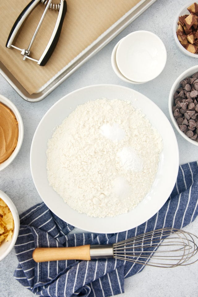 overhead view of dry ingredients for Nutella Peanut Butter Cookies in a mixing bowl