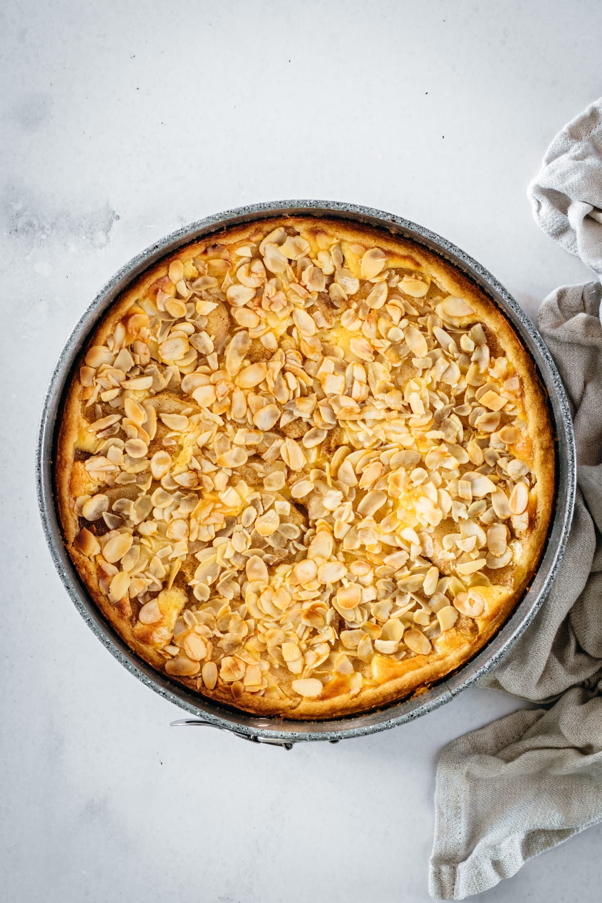 Overhead shot of pear tart in springform pan