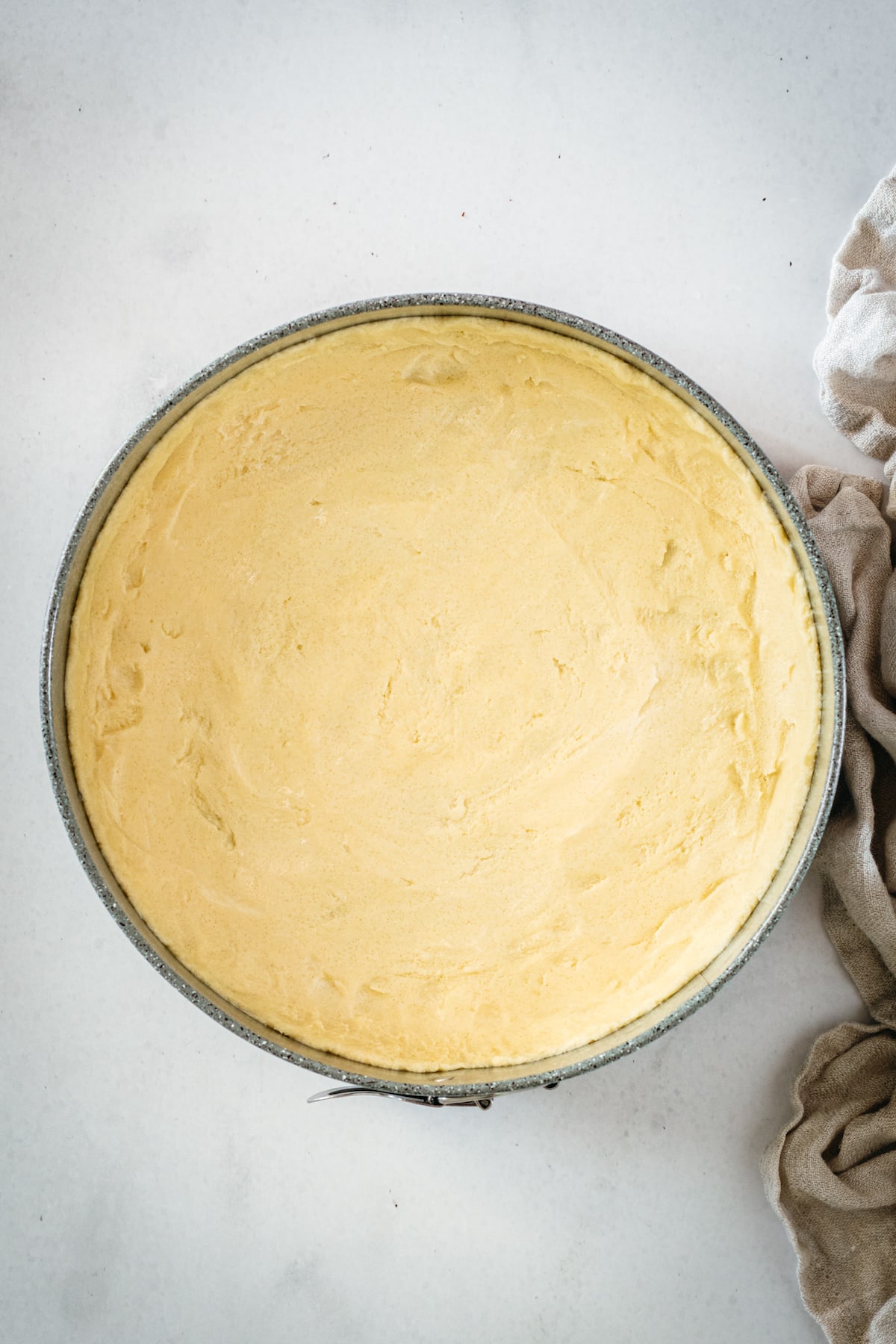 Overhead view of shortbread crust in springform pan