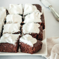 Platter of brownies topped with Swiss meringue