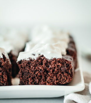 Closeup of brownie squares topped with meringue