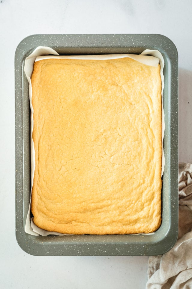 Overhead view of shortbread crust in baking pan