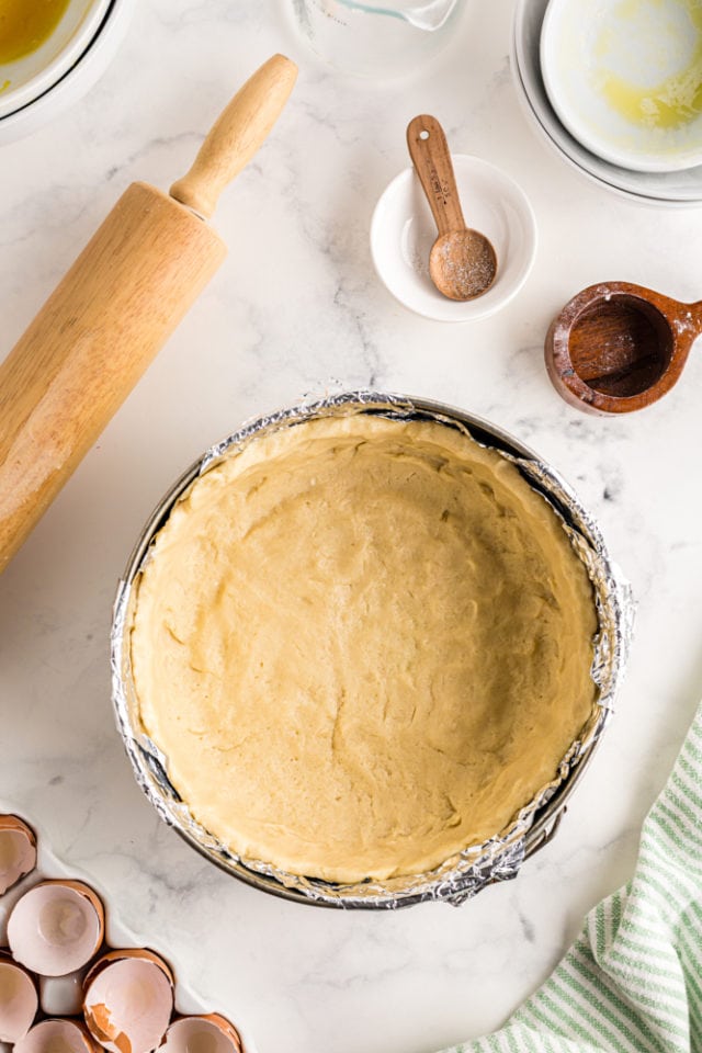 overhead view of pie dough in a springform pan