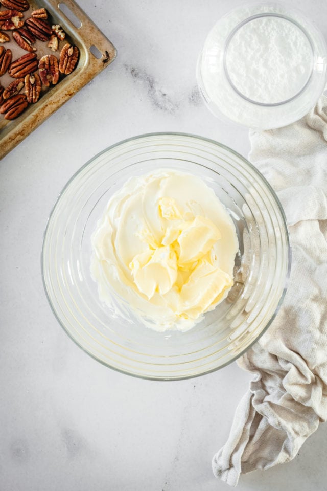 Overhead view of butter in glass mixing bowl