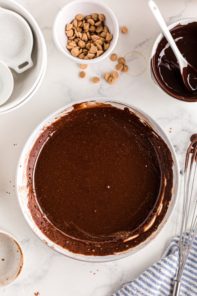 overhead view of chocolate glaze in a white mixing bowl