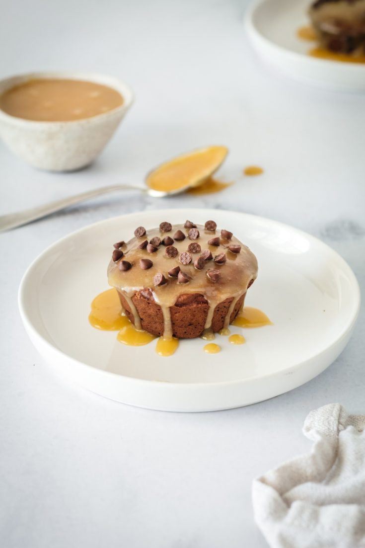 Plated mini chocolate pound cake glazed with butterscotch and topped with chocolate chips