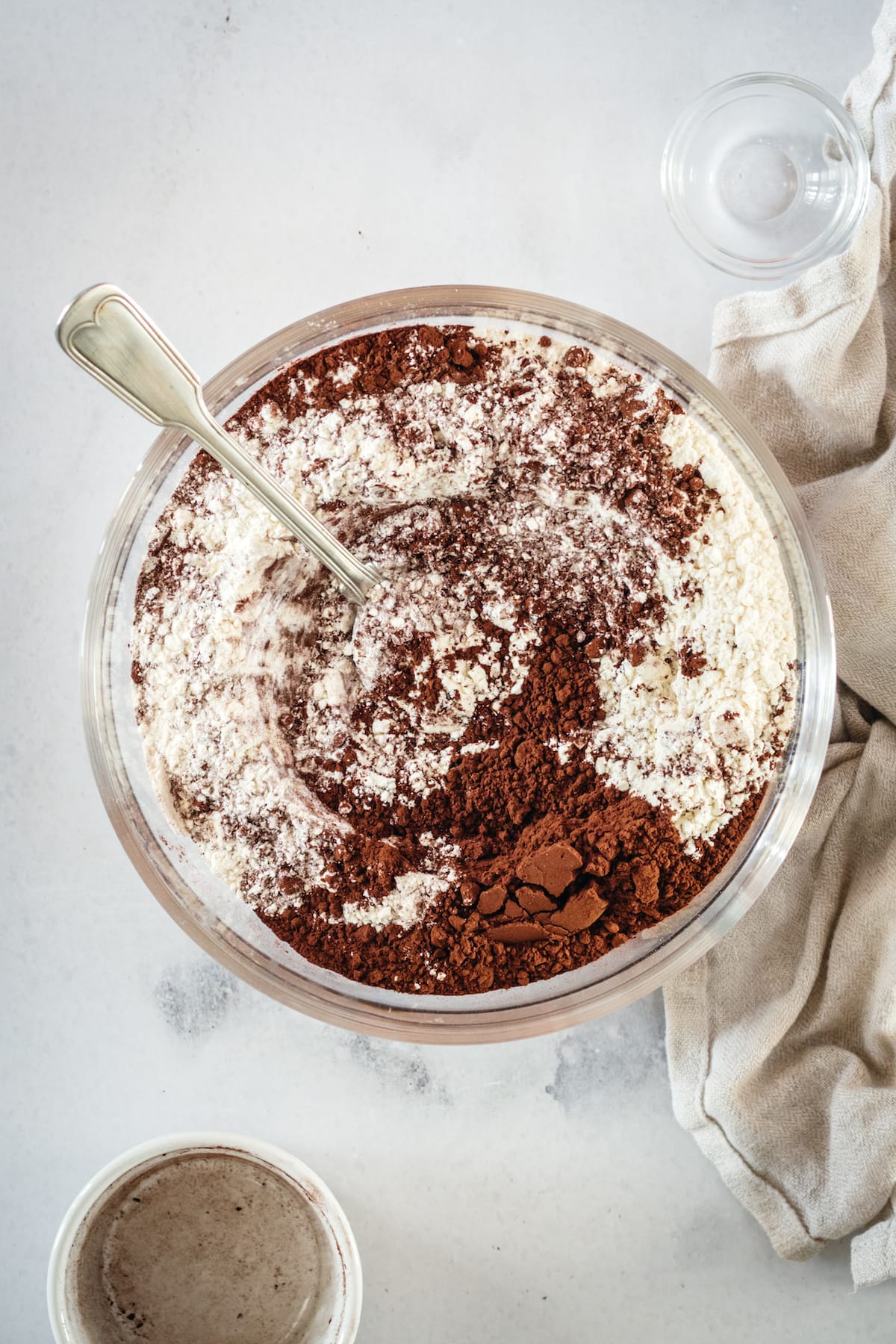 Overhead view of dry ingredients for chocolate pound cake in mixing bowl