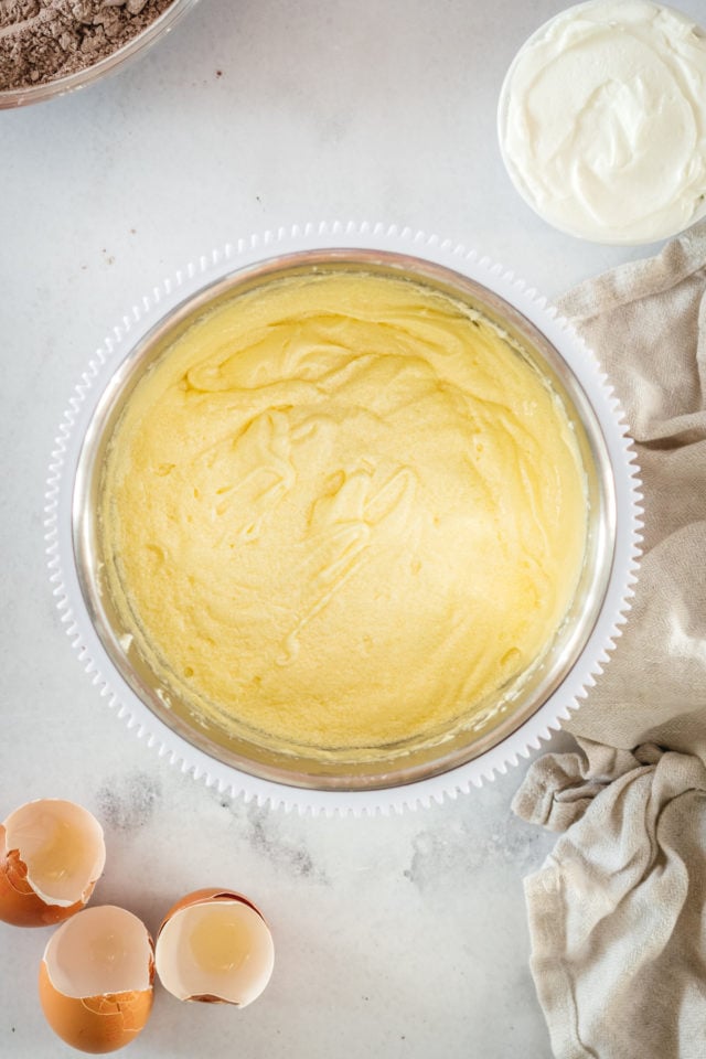 Overhead view of creamed butter and sugar in mixing bowl