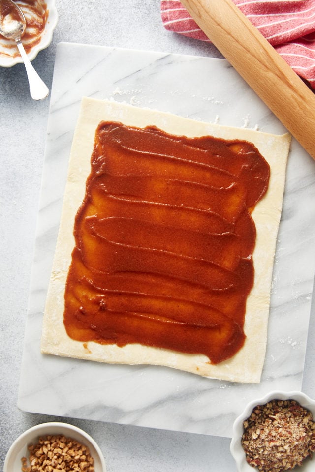 overhead view of apple butter spread on puff pastry