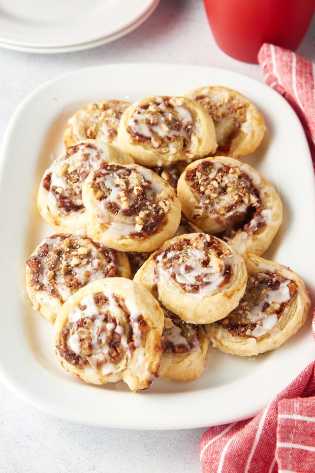Apple Butter Pinwheels piled on a white serving tray
