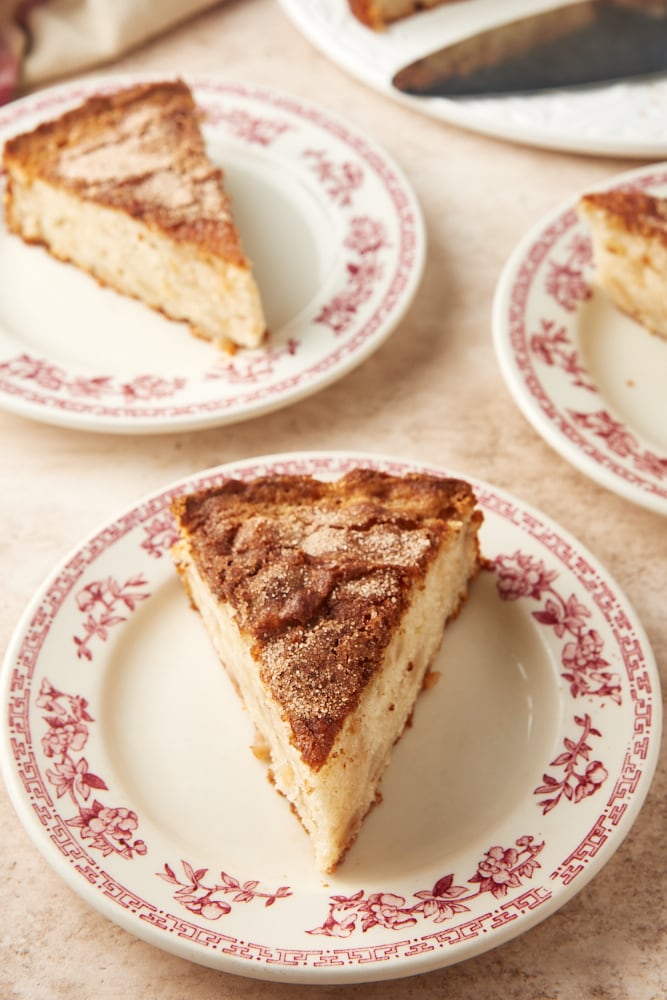 pear cake slices on floral-rimmed white plates