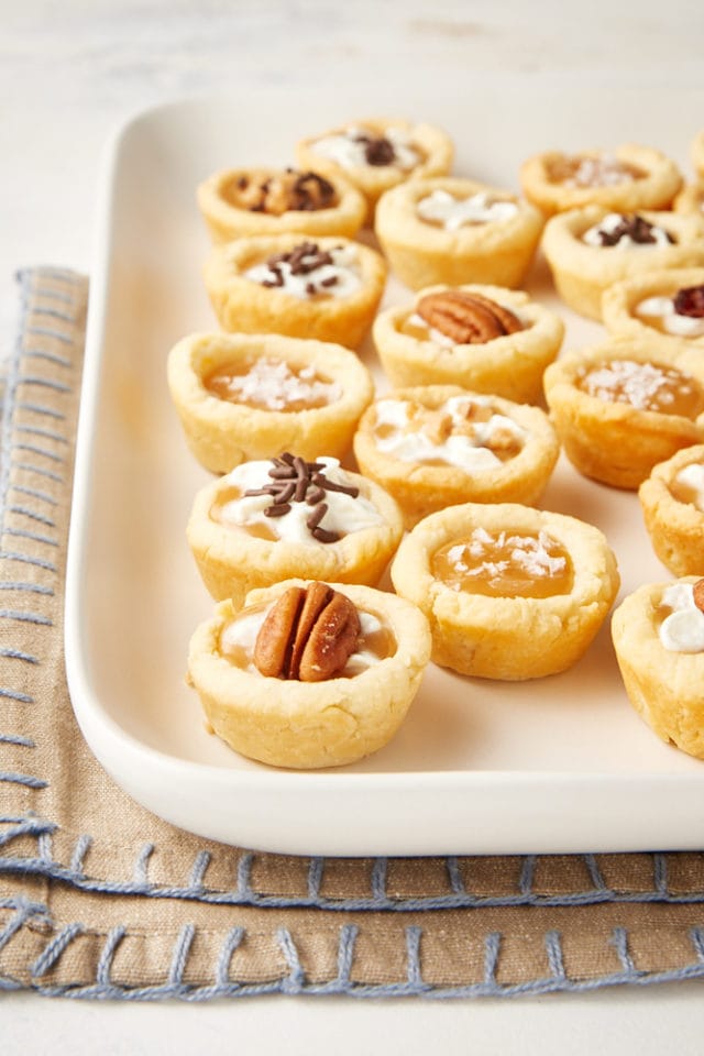 Mini Caramel Tarts on a white serving tray