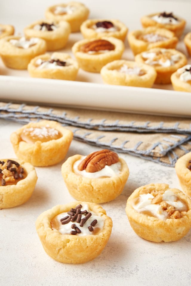 Mini Caramel Tarts on a white and gray surface