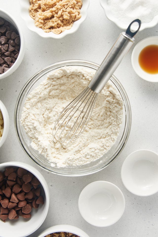 overhead view of dry ingredients in a glass mixing bowl
