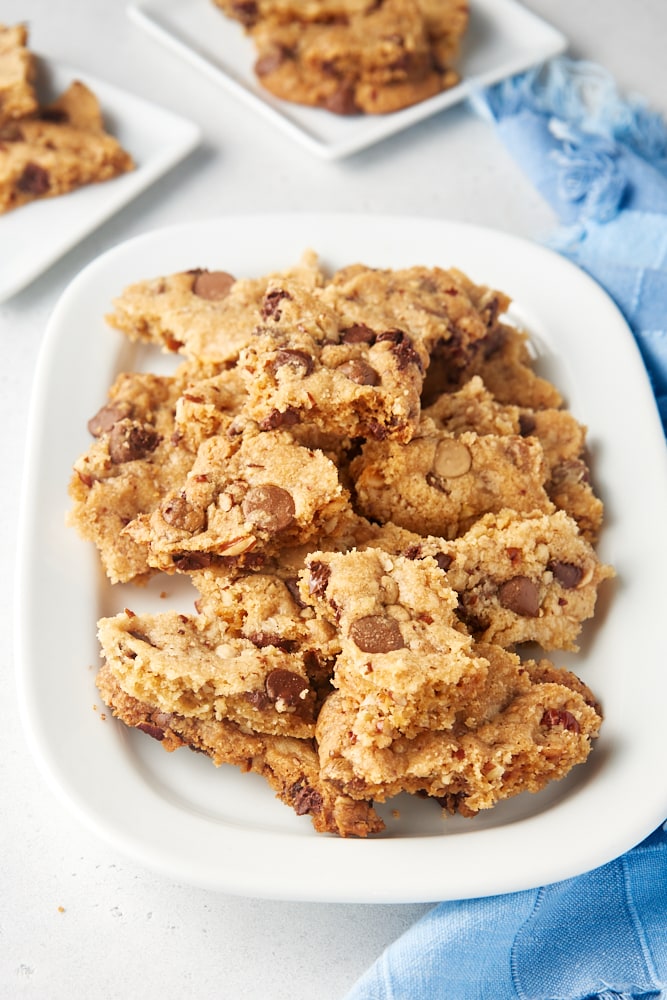 Chocolate Chip Cookie Brittle piled on a white tray