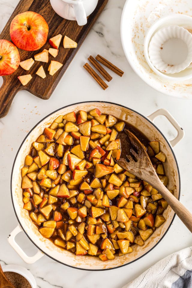 overhead view of cooked apple cobbler filling in a large pan