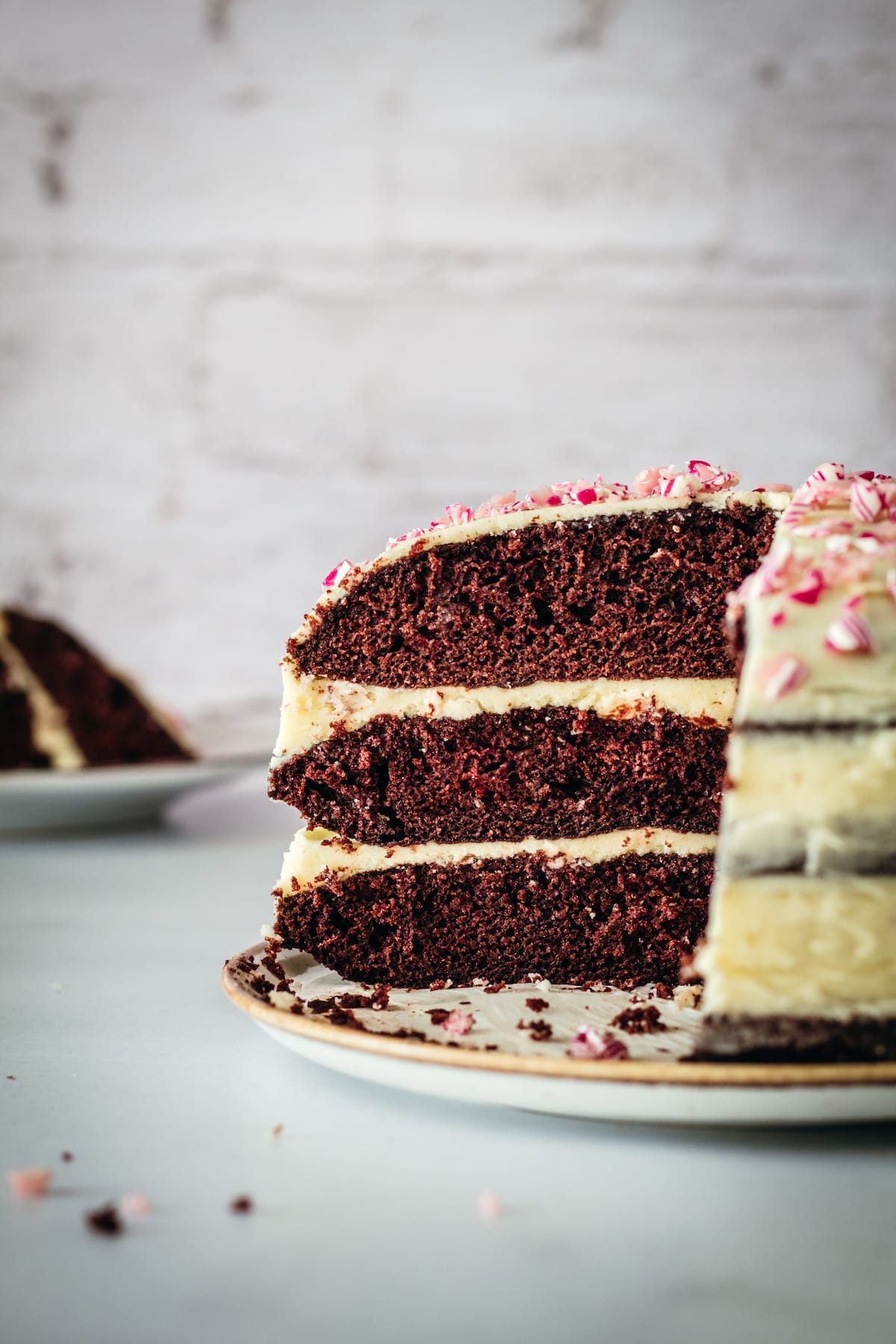 Side view of chocolate peppermint cake after 2 slices were removed