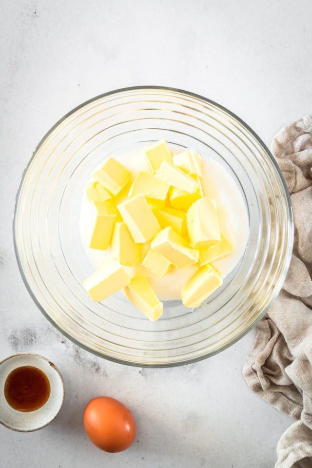 Butter and sugar in glass mixing bowl