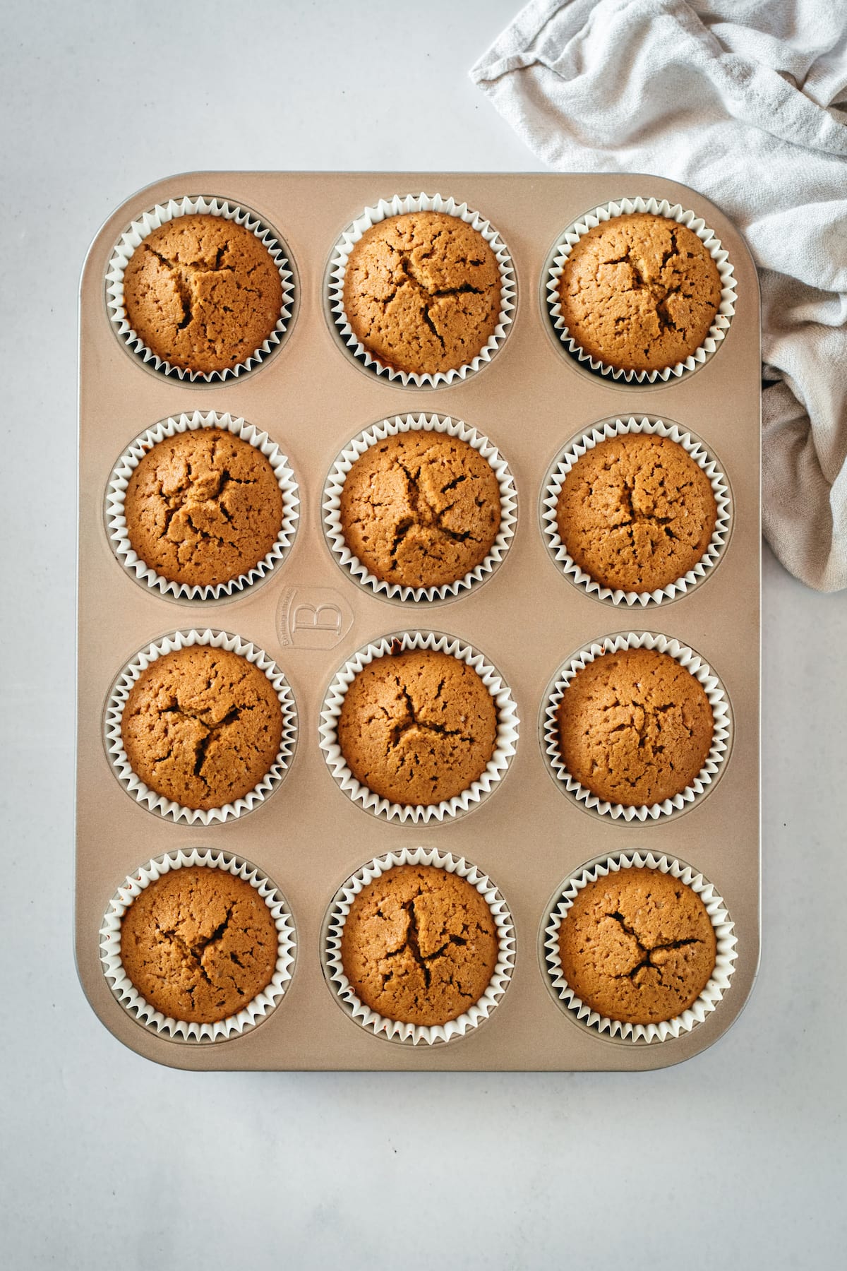Overhead view of baked gingerbread cupcakes in muffin tin