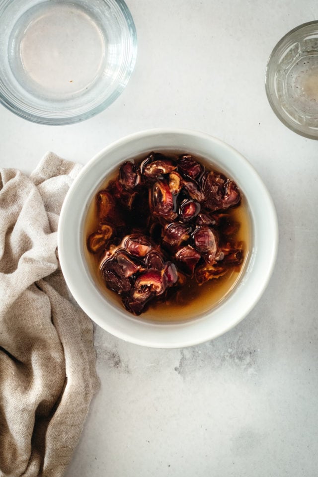 Overhead view of Kahlua and dates in a bowl.